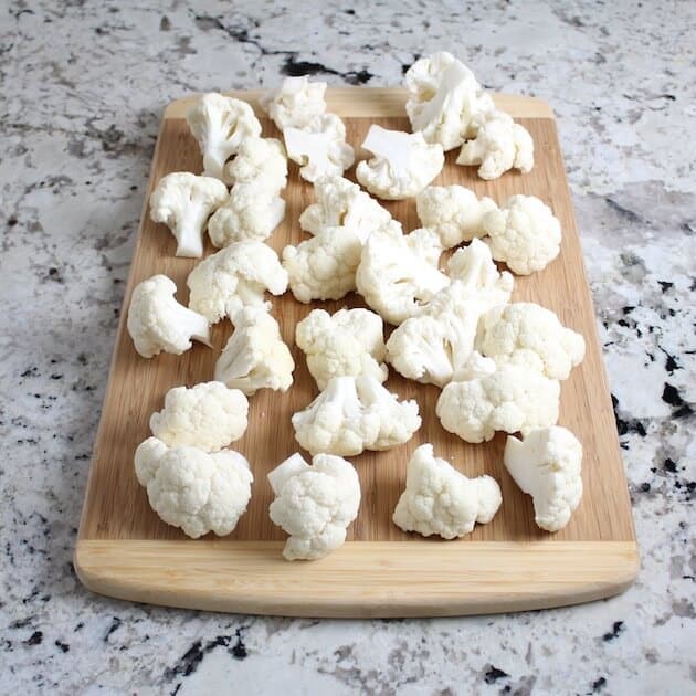 Florets of cauliflower on cutting board