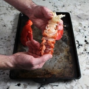 Pushing whole lobster tail out of shell