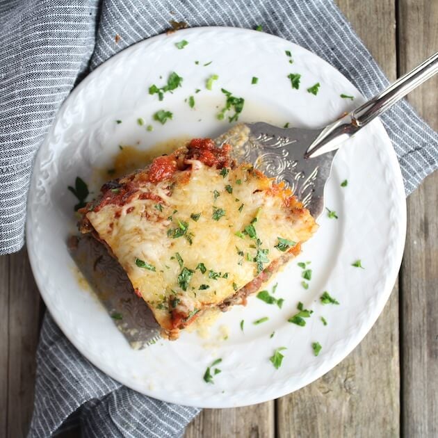 Spatula on plate with a piece of Lasagna 