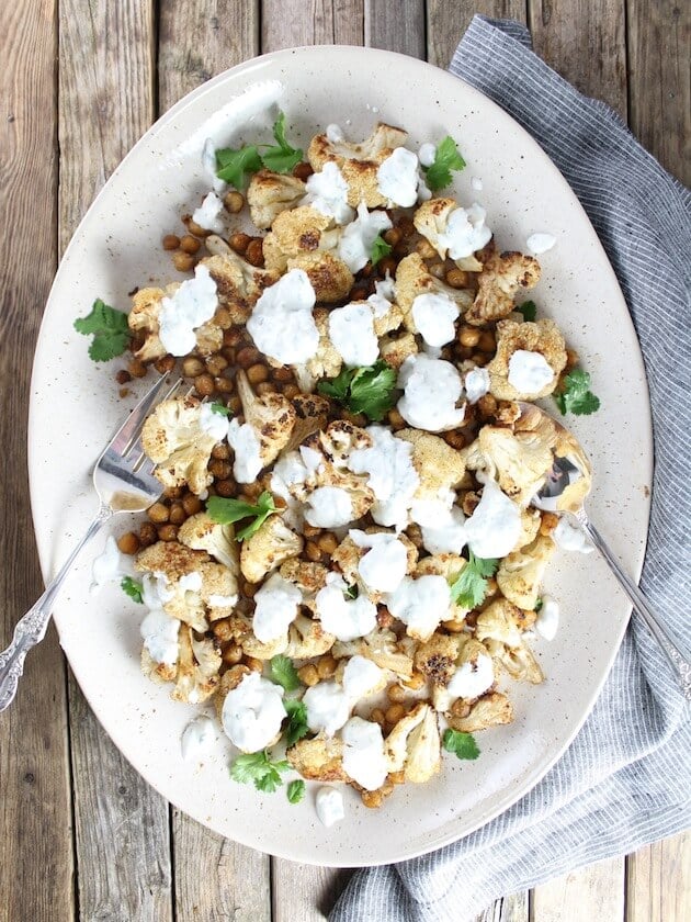 Serving platter with Roasted Cauliflower And Chickpeas With Yogurt Sauce