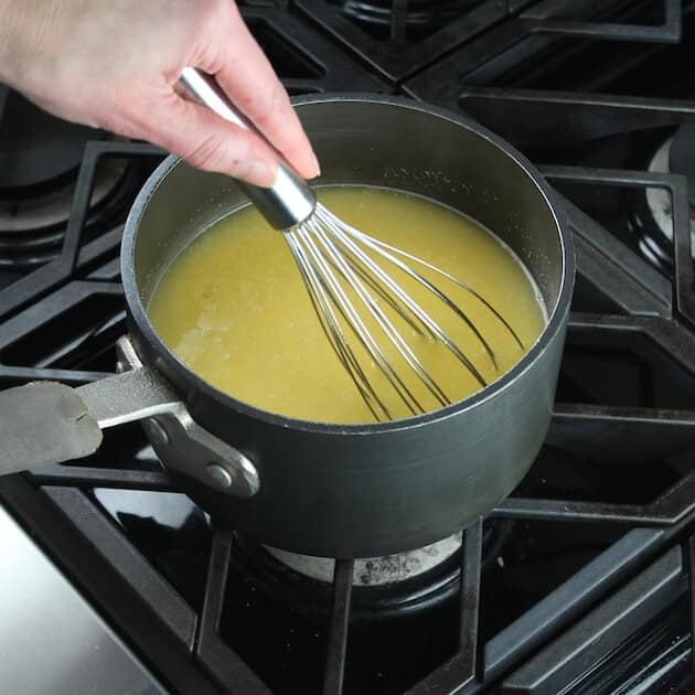 Stirring polenta in saucepan