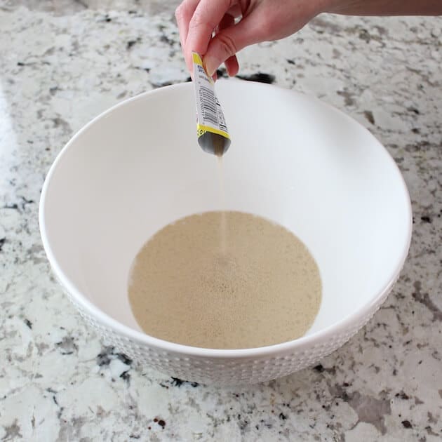 Adding yeast to mixing bowl