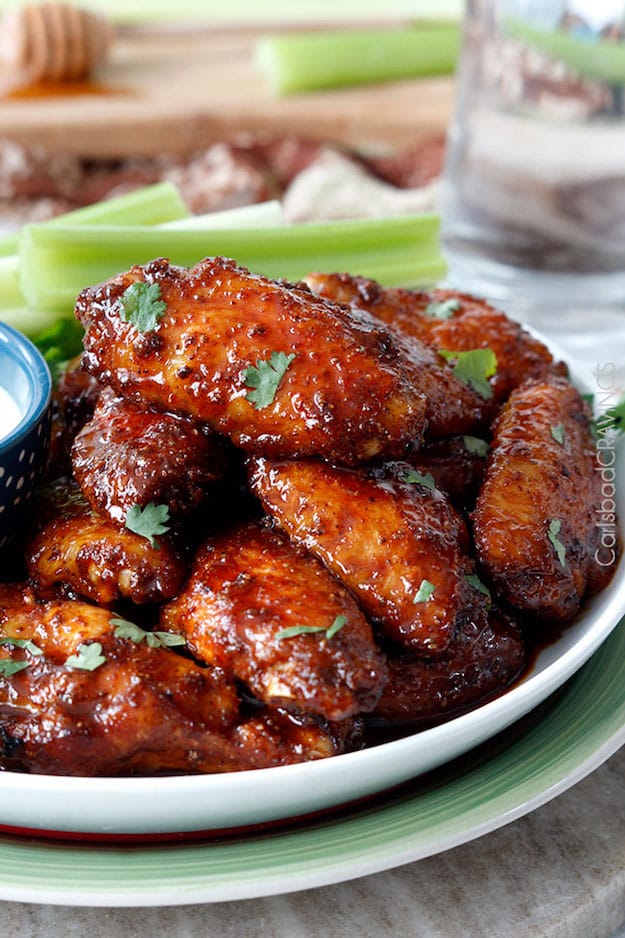 Buffalo-Honey-Hot-Wings stacked on platter on picnic table