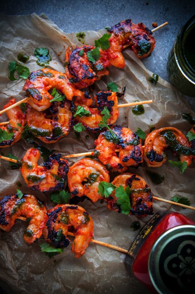 Grilled shrimp on skewers on parchment paper