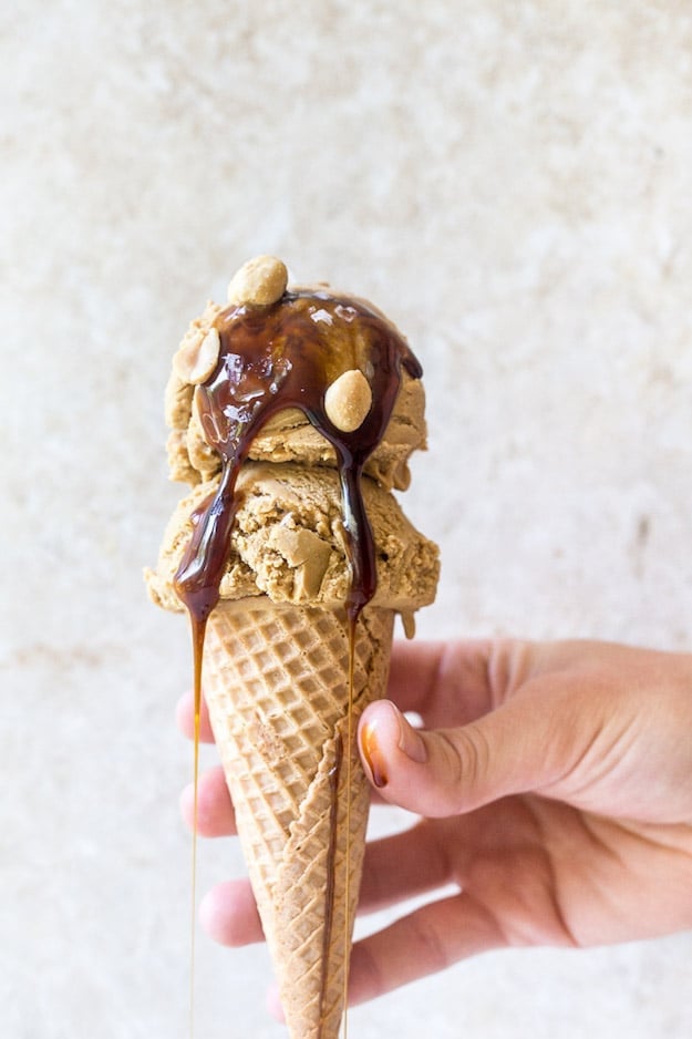 Two scoops of peanut-butter-molasses-ice-cream on a sugar cone