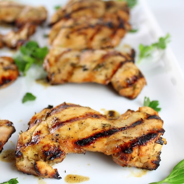 Partial view of platter of Grilled Chicken Thighs