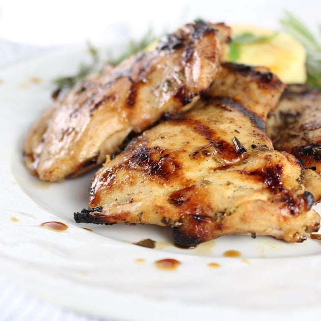 Grilled  Chicken Thighs stacked on a plate 