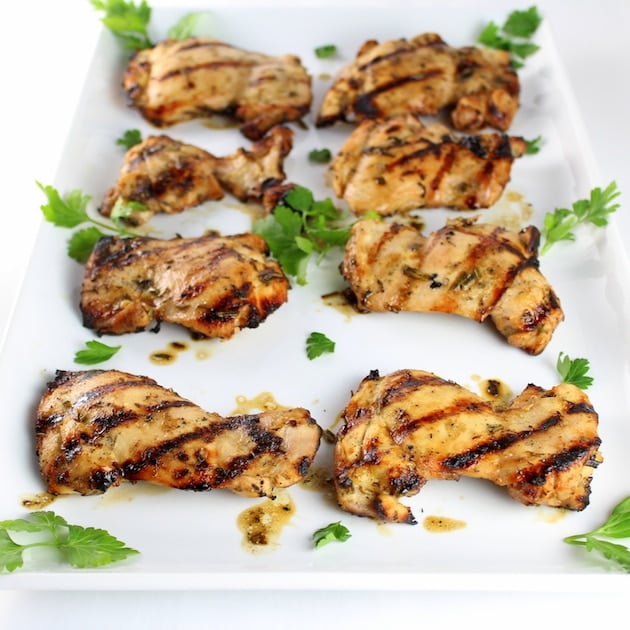 Grilled Rosemary Lemon Chicken Thighs on a serving platter