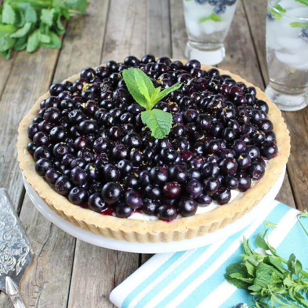 Summer Blueberry Mascarpone Tart on cake platter