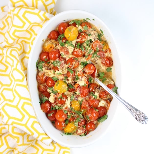 Sweet Cherry Tomatoes with French Feta in serving dish with antique serving spoon