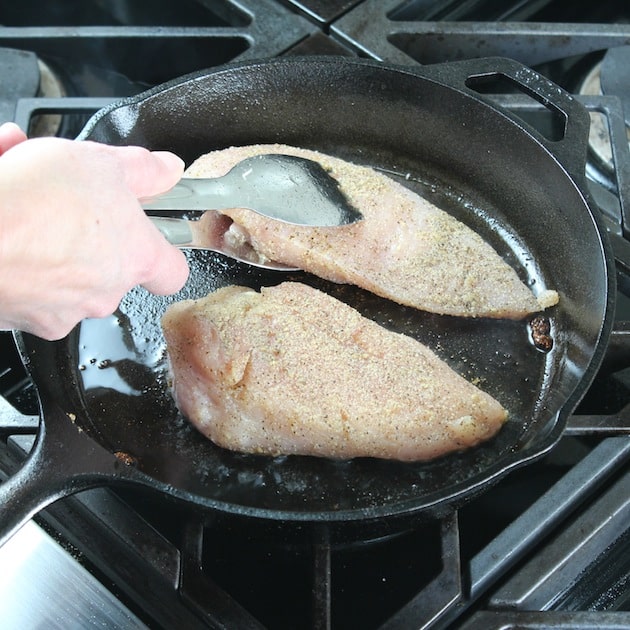 Adding chicken to saute pan