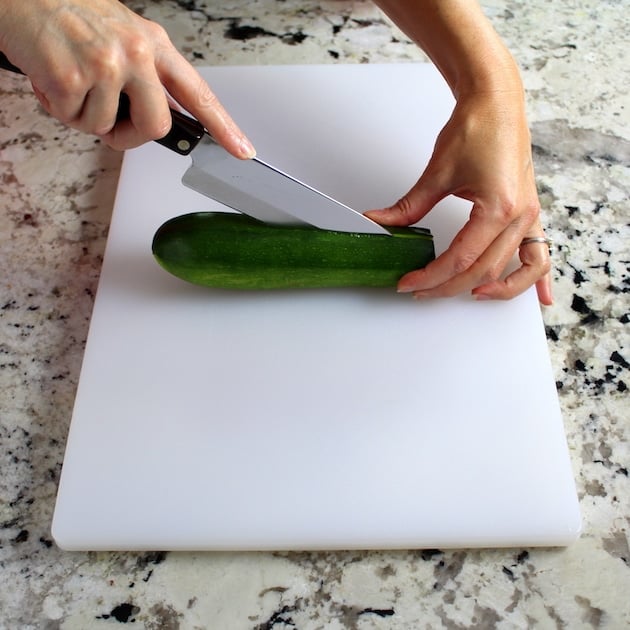 Slicing zucchini on cutting board