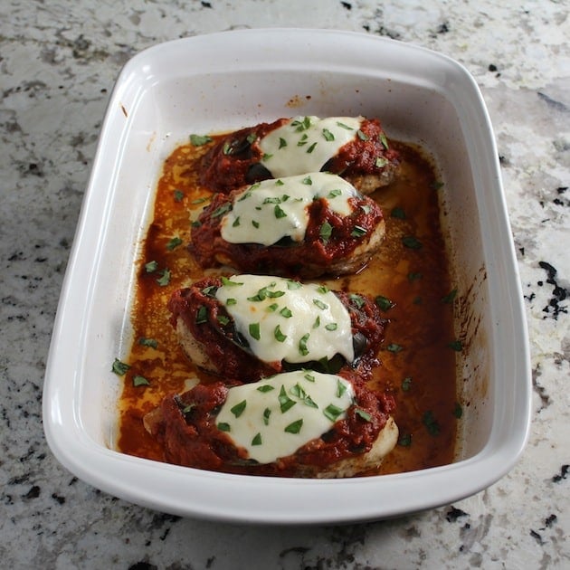 Fresh mozzarella melted over chicken in casserole dish