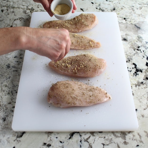 Adding garlic powder to chicken breasts before cooking
