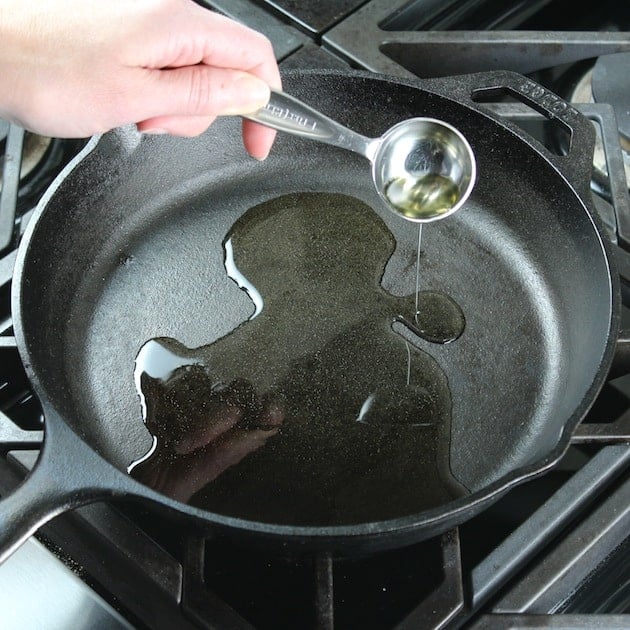 Adding oil to skillet