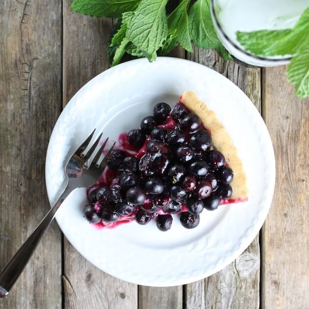 Slice of blueberry pie on plate