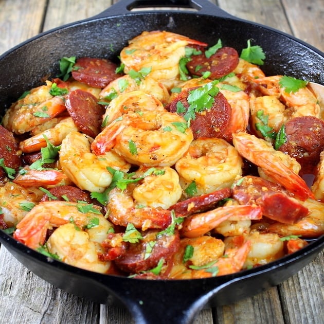 Eye level cast iron skillet with Chorizo Shrimp appetizer