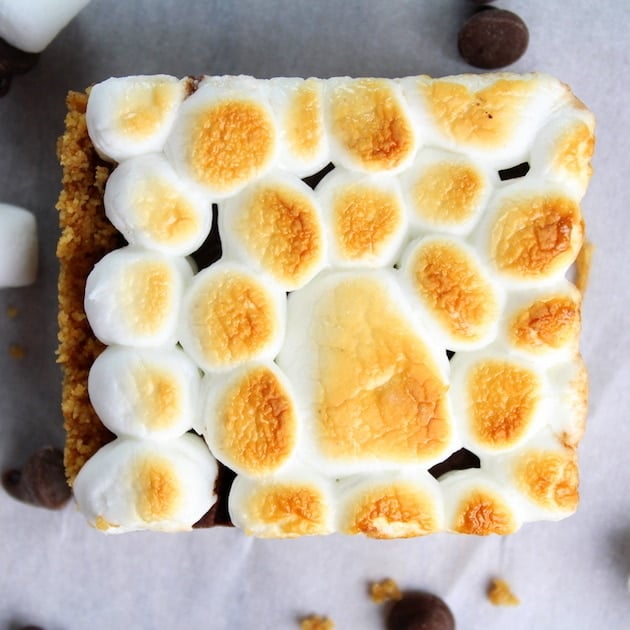 Toasted marshmallows on top of one Baked Nutella S\'mores square