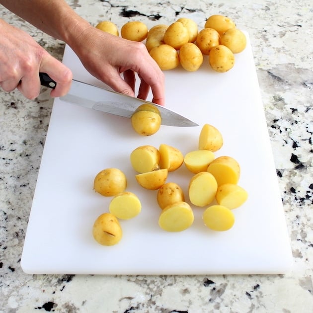 cutting potatoes on cutting board