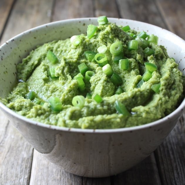 A bowl of green Hummus