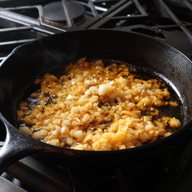 Diced onion cooking in saute pan