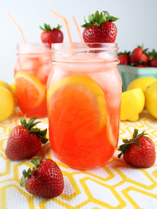 Spiked lemonade with strawberry in mason jars