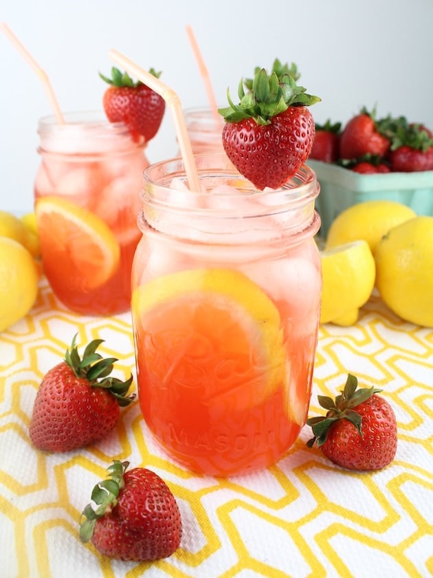 Three mason jars iwth Strawberry Lemonade Vodka Cocktail
