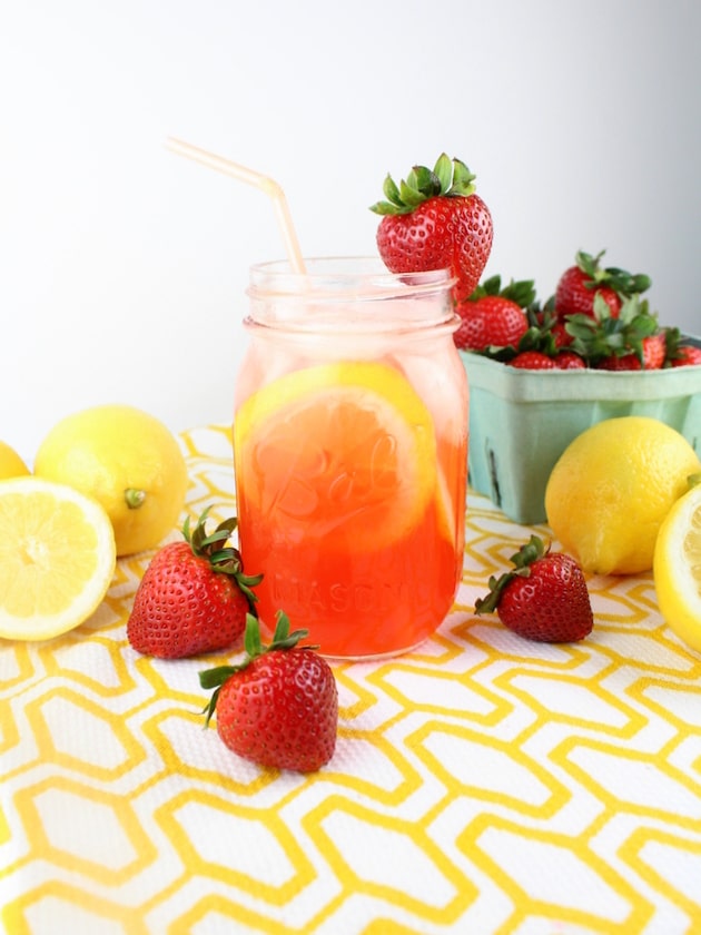 Loaded Strawberry Lemonade in a mason jar with a straw