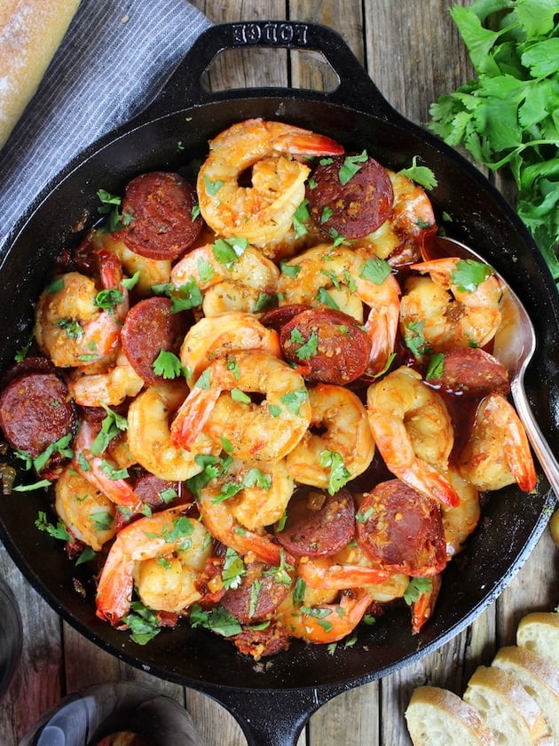 Sun-Dried Tomato Chorizo Garlic Shrimp in skillet with french bread