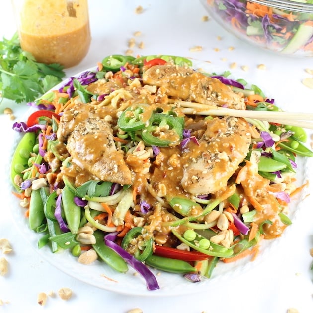 Plate of Chicken Satay Zoodle Salad with chopsticks and peanut dressing