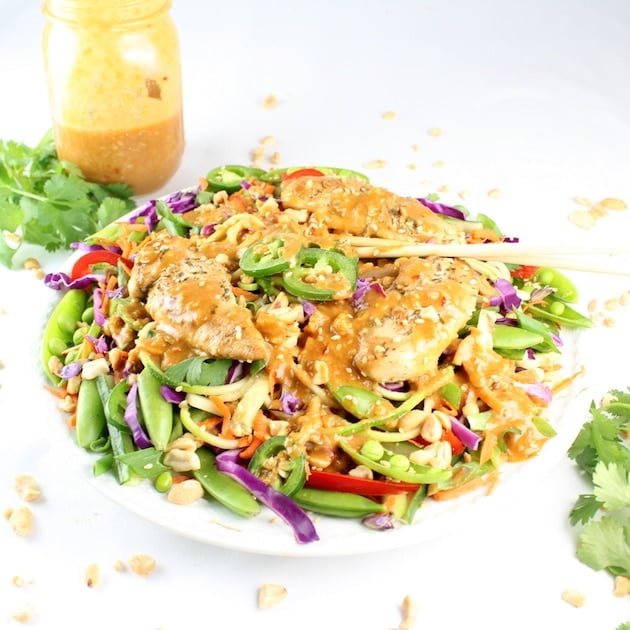 Chicken Satay Zoodle Salad with mason jar of peanut satay dressing