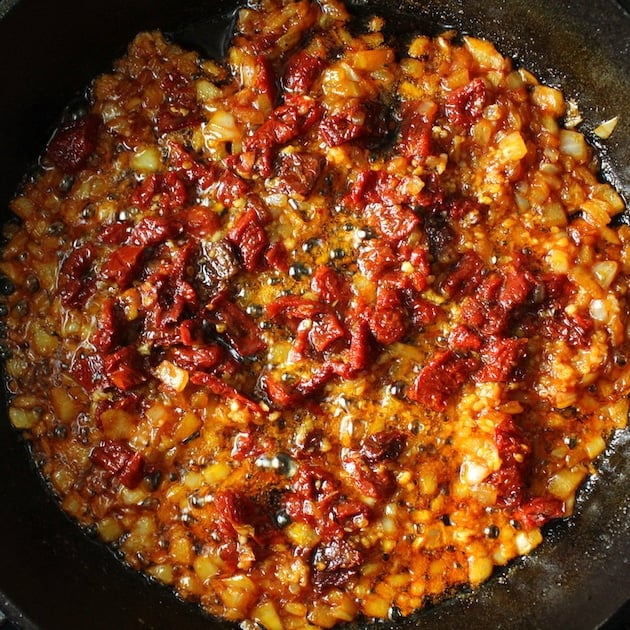 Sun-Dried Tomato cooking in skillet with garlic and onion