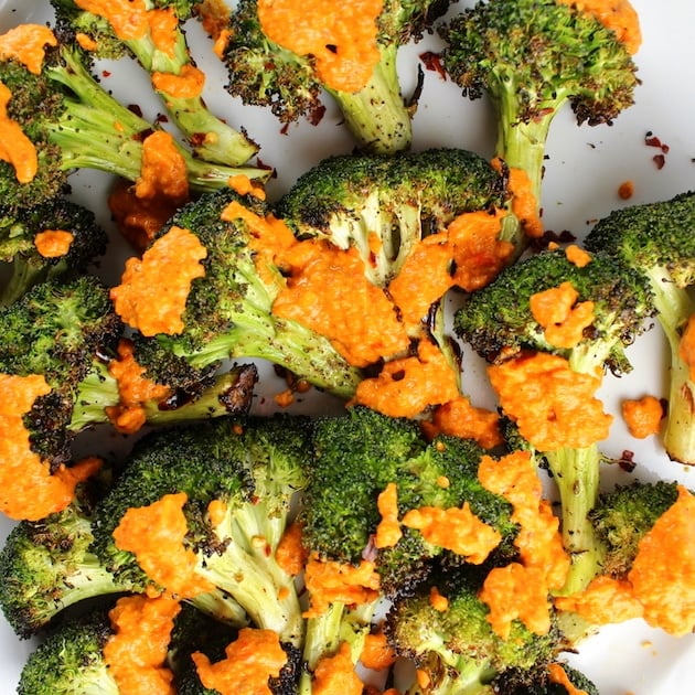 Close up of Grilled Broccoli with Red Pepper Sauce