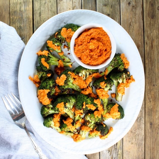 Grilled Broccoli with ramekin of Garlic Roasted Red Pepper Sauce on platter