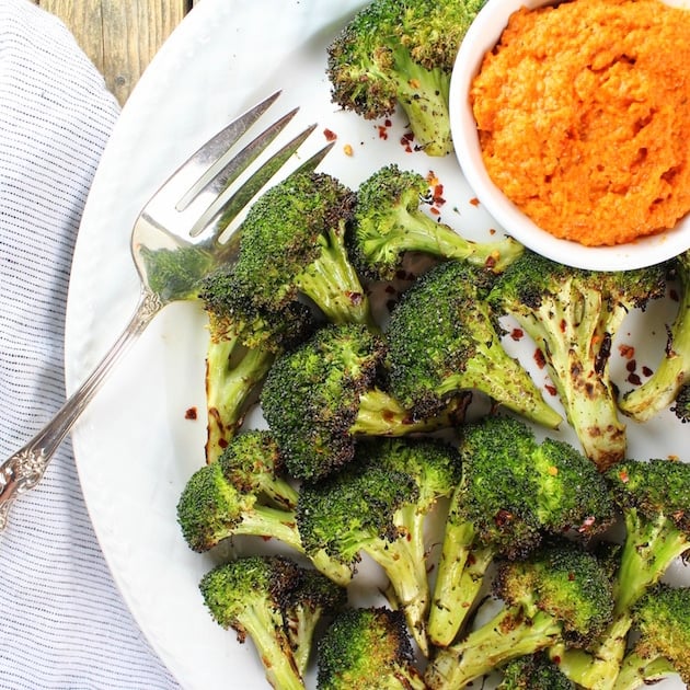 Partial platter of Grilled Broccoli florets with Red Pepper Sauce