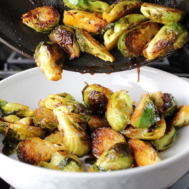 Transferring caramelized Brussels Sprouts to white serving dish