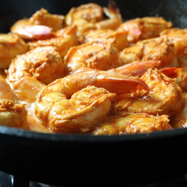 Eye level shrimp cooking in a pan