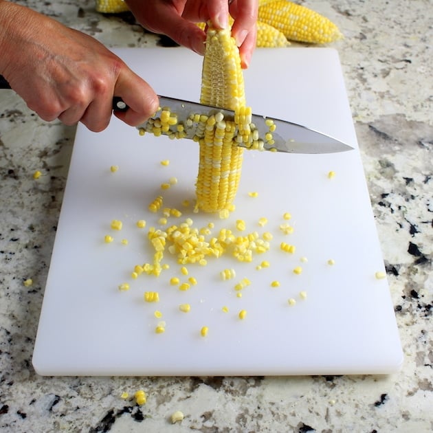 Cutting corn off the cob