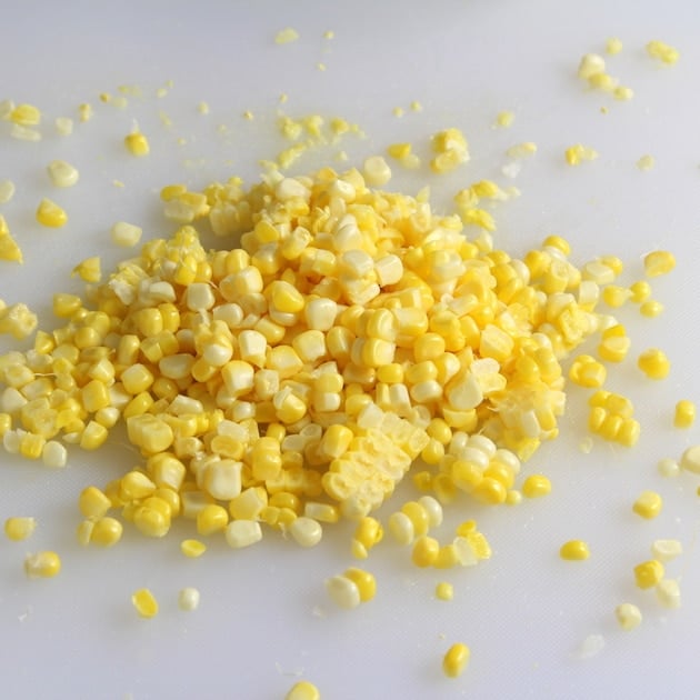 Garden fresh corn kernels on a cutting board