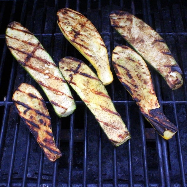 Squash and zucchini cooking on the grill