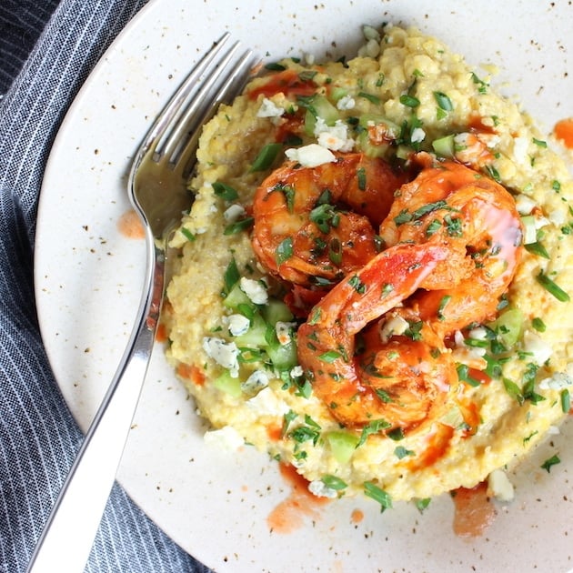 Over top Buffalo Shrimp and Blue Cheese Grits