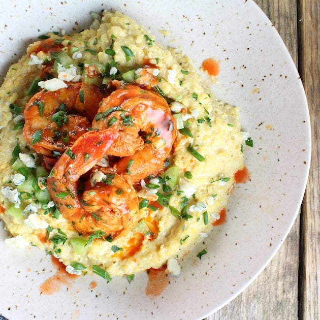 Over top partial bowl of Buffalo Shrimp and Blue Cheese Grits