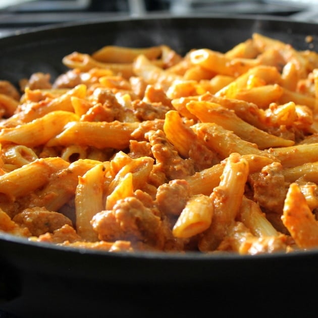 Eye level Spicy Chicken Pasta and Peas with Sun-Dried Tomato Sauce