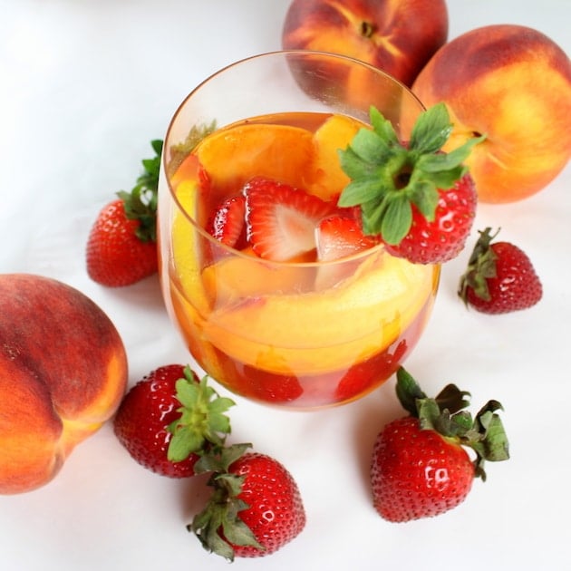 Strawberry Peach Rosé Sangria in a glass with strawberry garnish