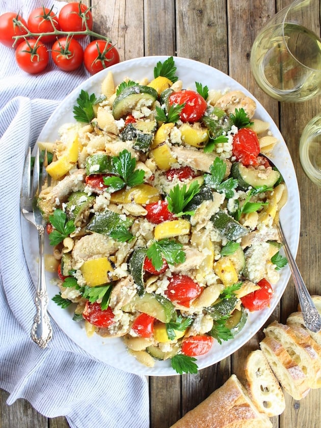 Platter of Grilled Chicken and Squash with Tomato Feta Pasta with vine-ripened tomatoes and white wine