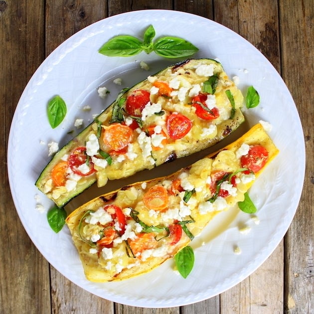 grilled squash stuffed with tomatoes and feta