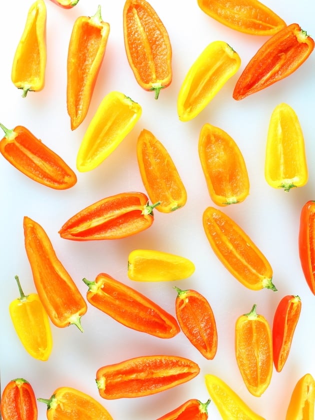 red orange and yellow Mini Peppers halved and cored, ready to stuff