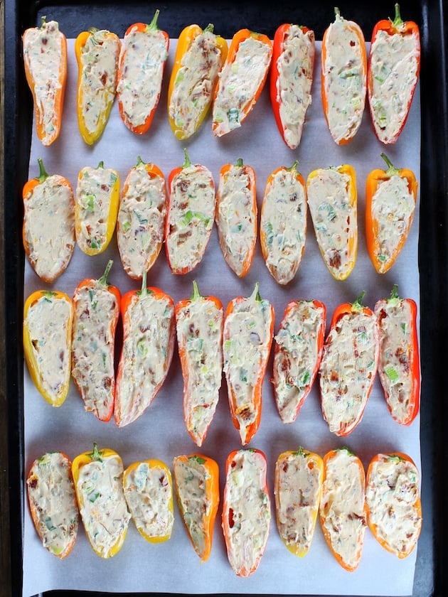  Mini Peppers Stuffed with Cheesy Ranch lined up on baking sheet ready to cook 