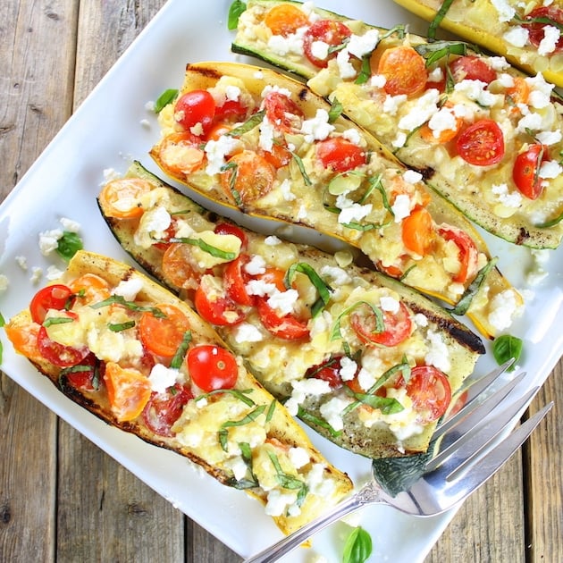 grilled squash stuffed with tomatoes and feta