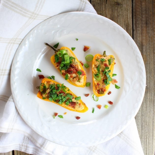 three Cheesy Ranch Stuffed Mini Peppers on a small plate